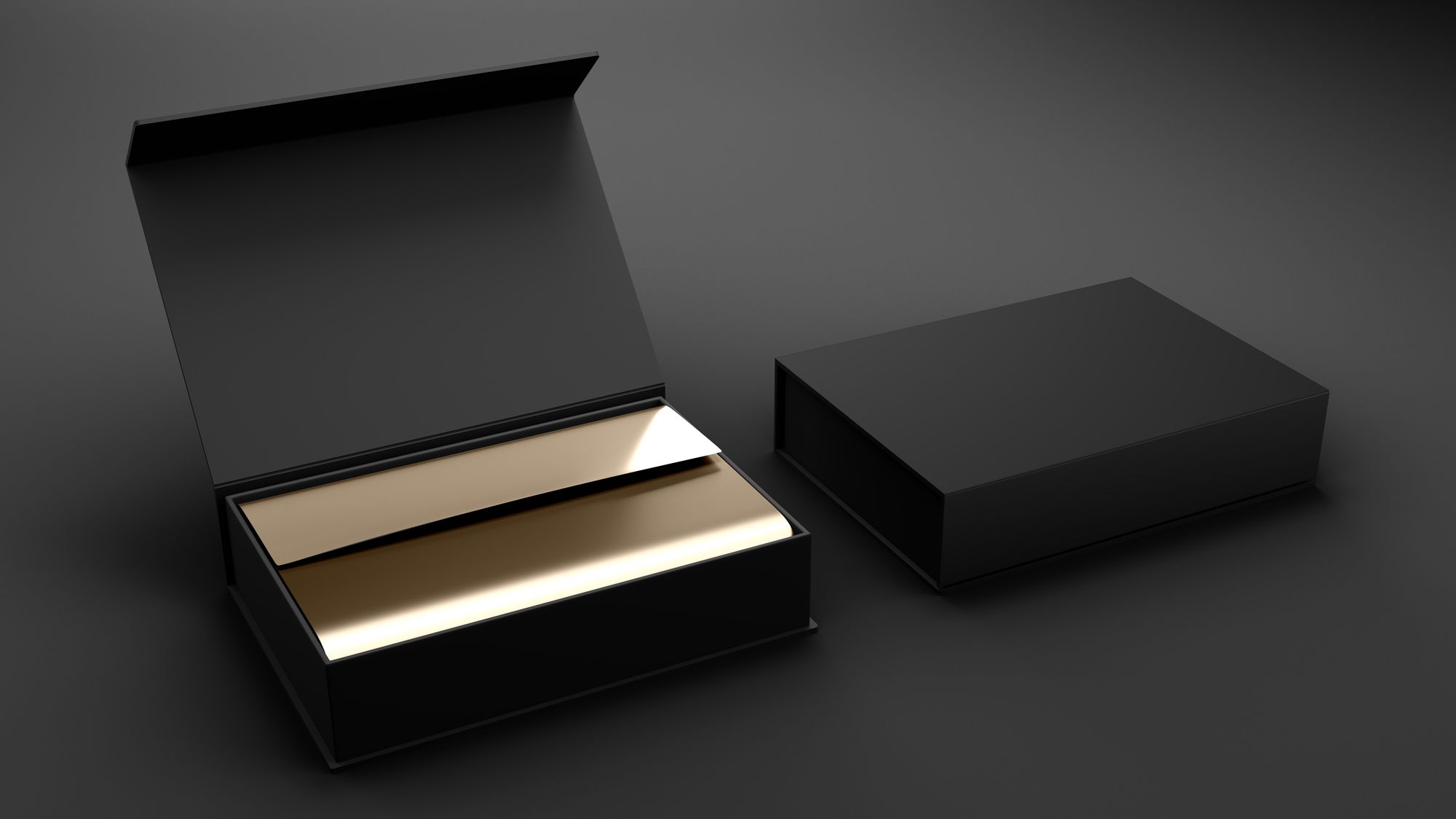 Black rigid product boxes on a dark background